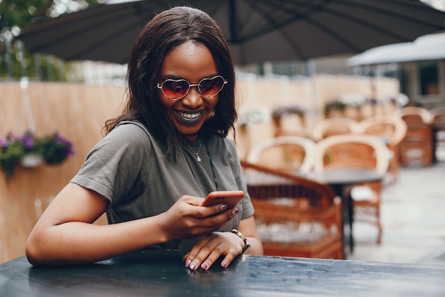 Elegant black girl in a summer city