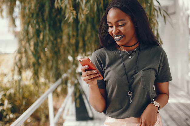 Elegant black girl in a summer city