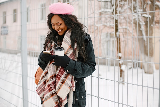 Elegant black girl in a winter city