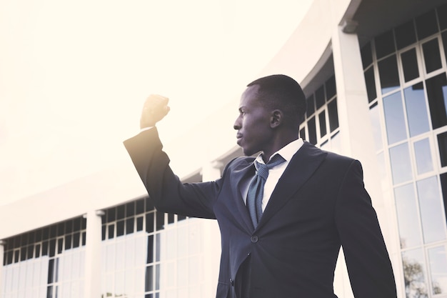 Elegant businessman with victory pose