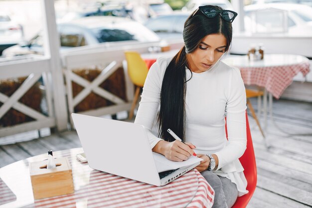 Elegant businesswoman in a summer city