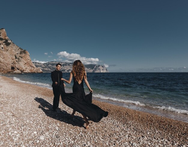 elegant couple in love outdoor at the beach