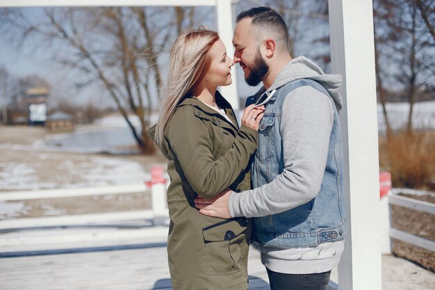 Elegant couple in a winter park