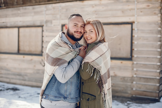 Elegant couple in a winter park