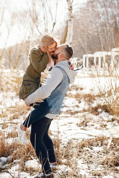 Elegant couple in a winter park