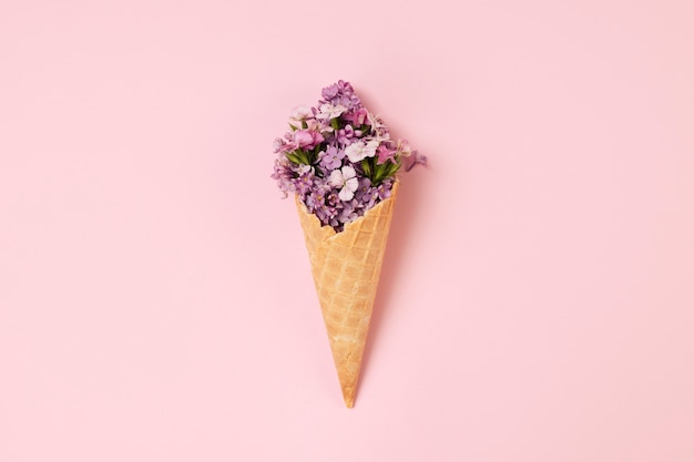 Elegant eco food concept with flowers in ice cream cone