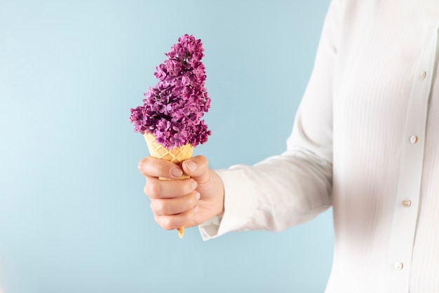 Free photo elegant eco food concept with flowers in ice cream cone