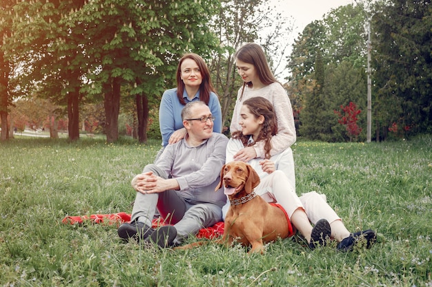 Elegant family spend time in a summer park