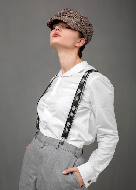 Free photo elegant female model in elegant white shirt and suspenders. new feminity concept