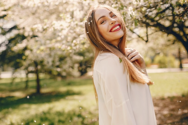 Elegant girl in a spring park