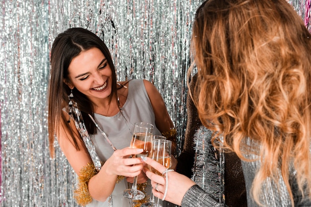 Elegant girls toasting with champagne