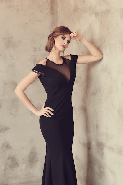 Free photo elegant and glamorous woman with black dress posing, fashion concept