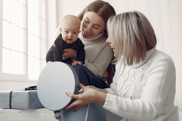 Elegant grandma at home with daughter and granddaughter