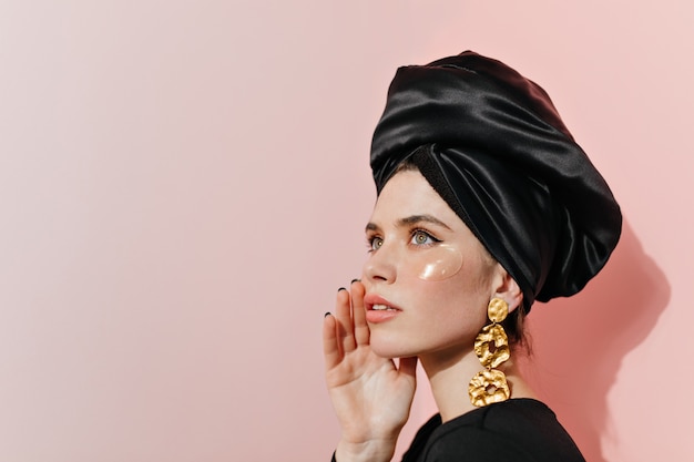 Free Photo elegant lady in turban using eye patches