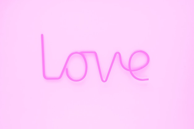 Free photo elegant love writing on pink