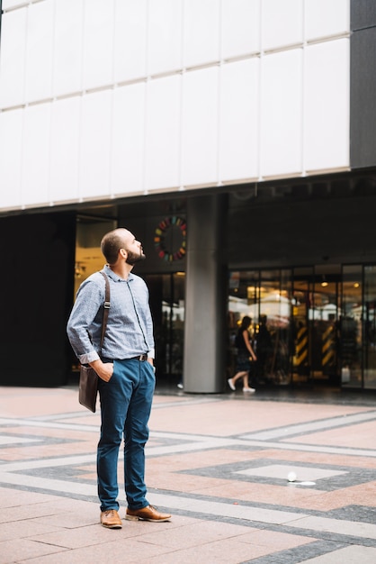 Free Photo elegant man exploring city streets