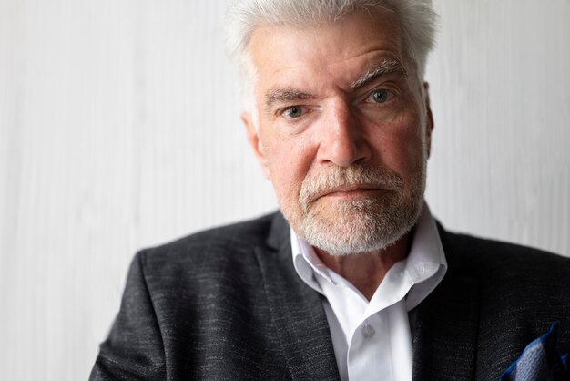 Elegant senior man posing in suit