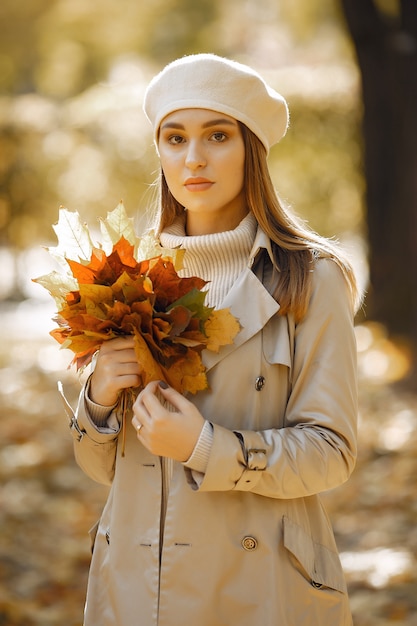 Elegant and stylish girl in a autumn park