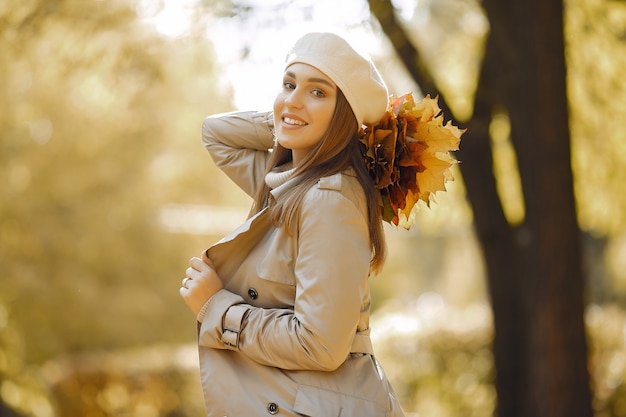 Elegant and stylish girl in a autumn park