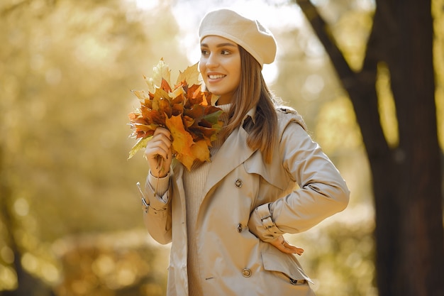 Elegant and stylish girl in a autumn park