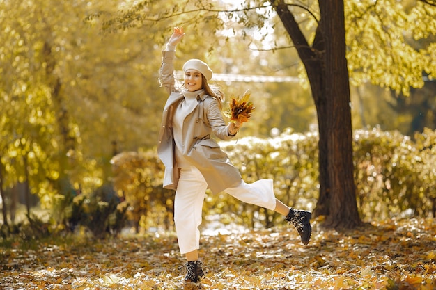 Elegant and stylish girl in a autumn park