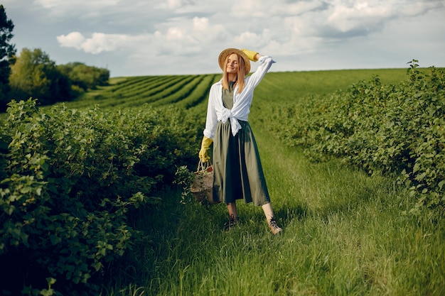 Elegant and stylish girl in a summer field