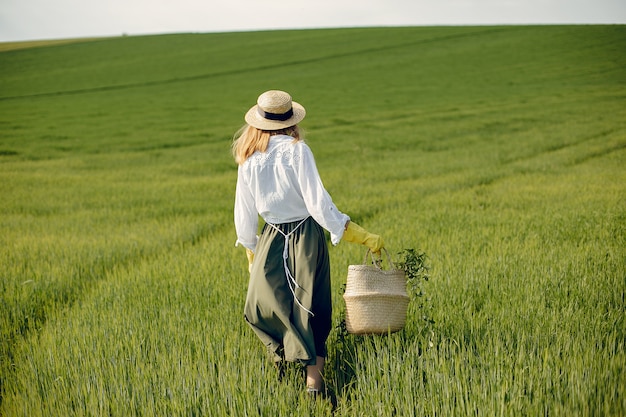 Elegant and stylish girl in a summer field