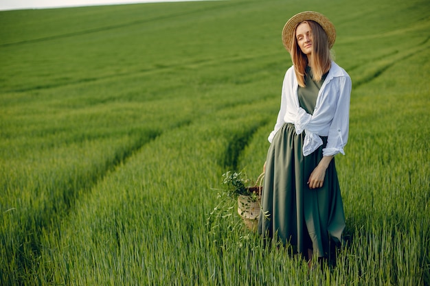 Elegant and stylish girl in a summer field