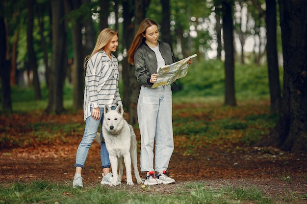 Elegant and stylish girls in a forest