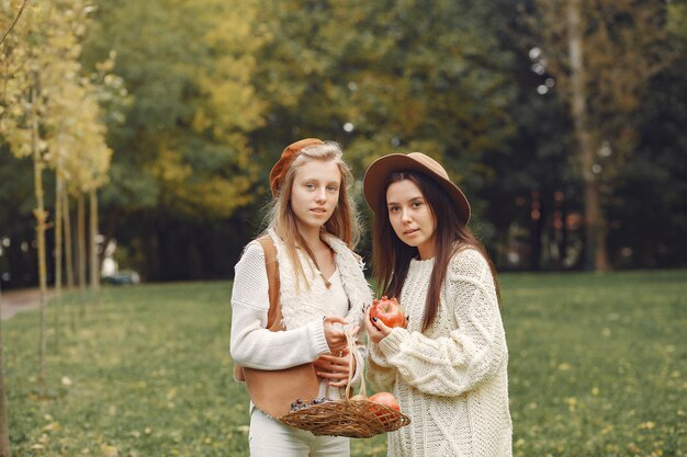 Elegant and stylish girls in a park