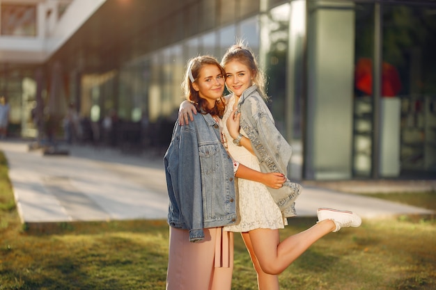 Elegant and stylish girls in a summer park