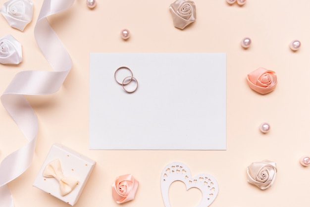 Elegant wedding invitation with engagement rings