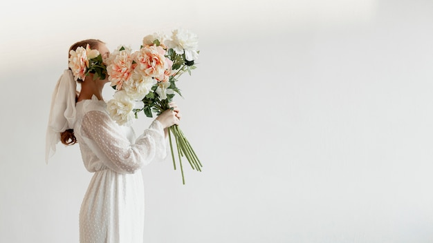 Elegant woman holding roses