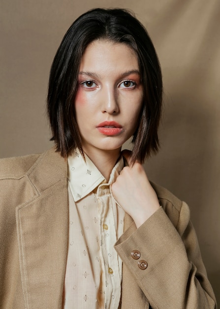 Elegant woman posing in suit