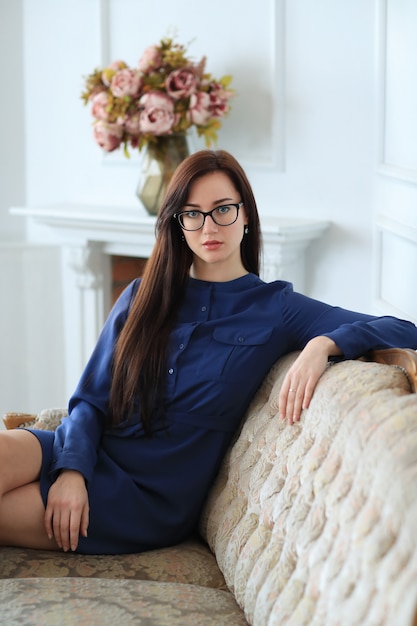 Elegant young woman posing at home