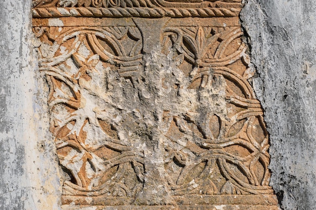 Elements of decor and stone carving with traces of destruction and vandalism the ghost town of the Greek city of Karmilissos near Fethiye in Turkey