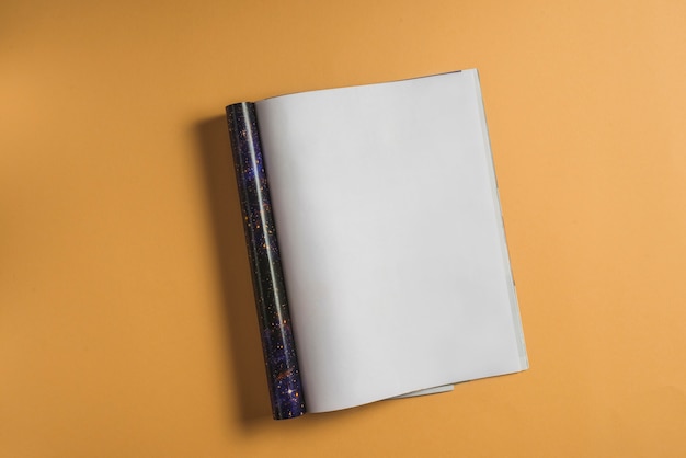 Free photo elevated view of blank notebook on vibrant background