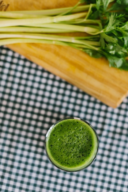 Free Photo elevated view of celery smoothie on desk