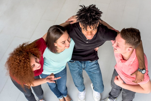 Free Photo elevated view of cheerful friends having conversation