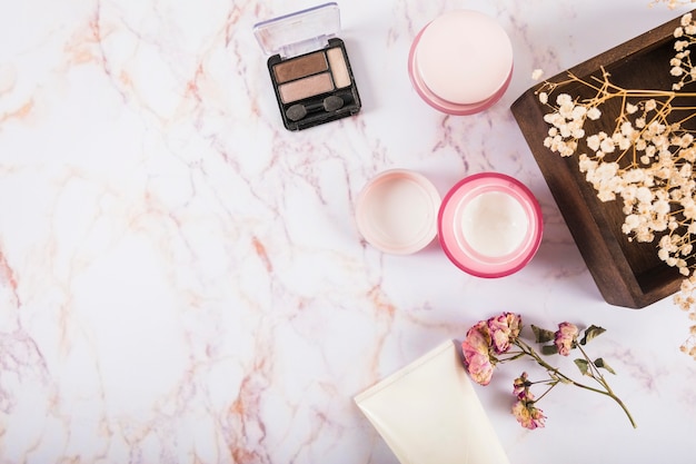 Elevated view of eye shadow powder and moisturizing cream