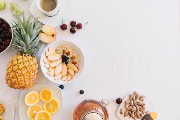 Free Photo elevated view of fresh healthy breakfast on white background