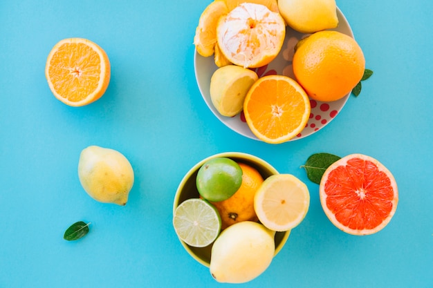 Free Photo elevated view of fresh juicy fruits on blue background