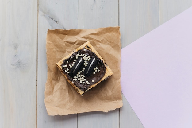 Elevated view of fresh pastry on brown paper