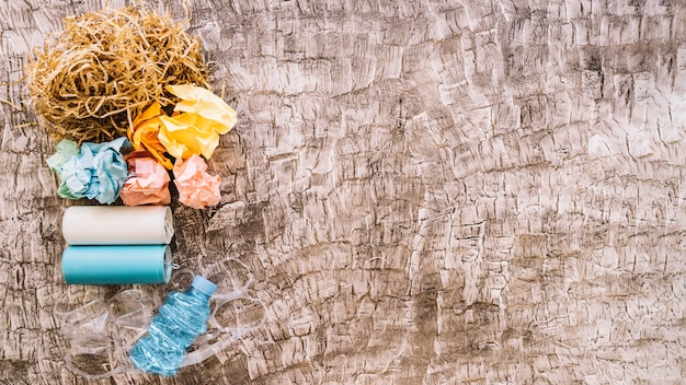 Free Photo elevated view of garbage over wooden background