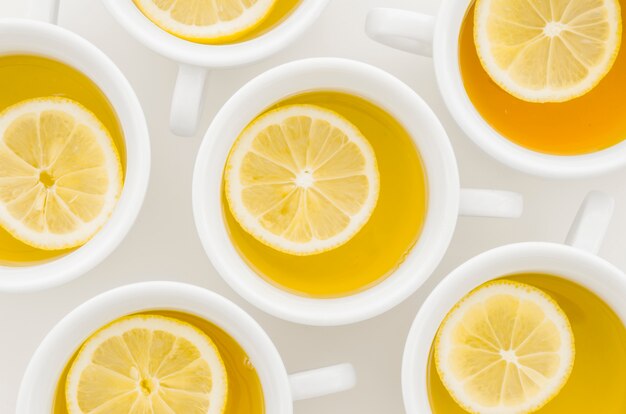 An elevated view of lemon tea cup isolated on white background