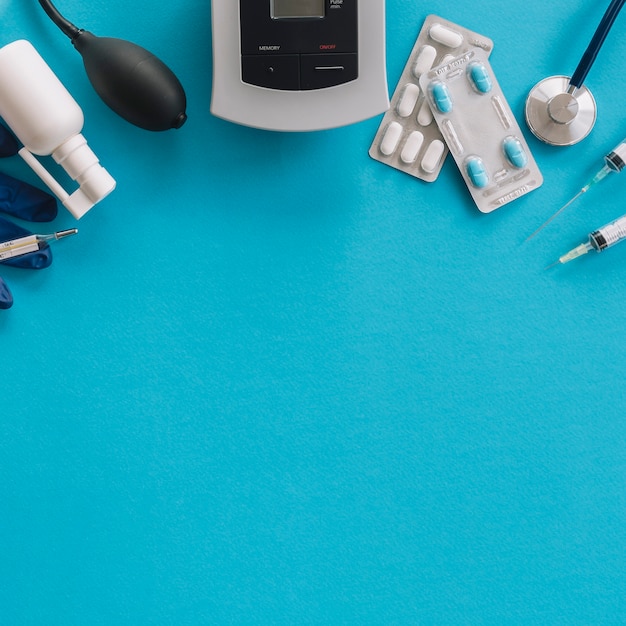 Free Photo elevated view of medical equipments on blue background