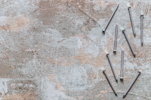 Free Photo elevated view of nails on old wooden desk