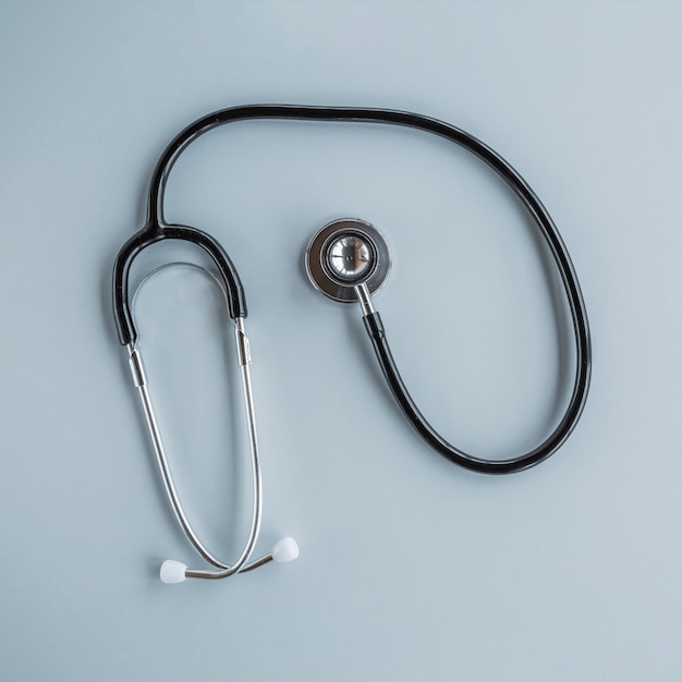 Free photo elevated view of stethoscope over grey background