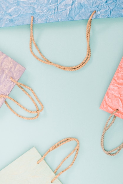 Free Photo elevated view of various shopping bags on green background