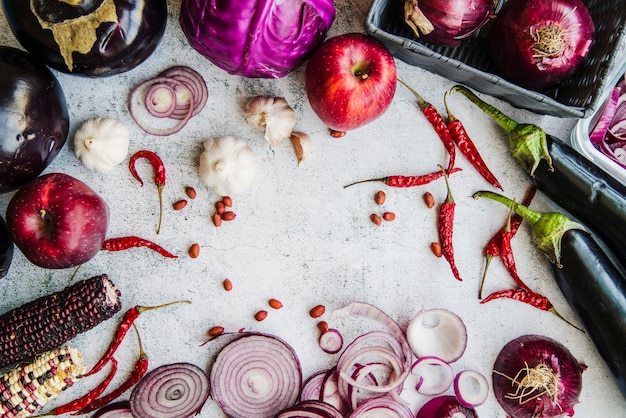 Free photo elevated view of vegetables and spices on textured white background